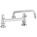 A chrome Equip by T&S deck-mounted faucet with lever handles and a swing spout.