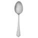 A silver spoon with a white handle.