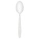 A Walco stainless steel dessert spoon with a white handle.