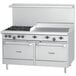 A large stainless steel U.S. Range with 4 burners, a griddle, and two ovens.
