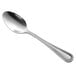 a silver spoon with a white background