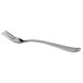 A close-up of a silver Libbey cocktail fork with a white handle.