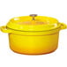 A GET yellow enamel coated cast aluminum dutch oven with a lid.