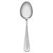 A Libbey stainless steel medium weight teaspoon with a white handle on a white background.