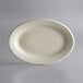 A white oval Libbey stoneware platter with a rolled edge on a gray background.