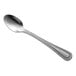 A Libbey stainless steel demitasse spoon with a silver handle.