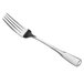A close-up of a Libbey stainless steel dinner fork with a silver handle.