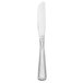 A Libbey stainless steel dinner knife with a white handle and black border on a white background.