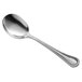 A Libbey McIntosh stainless steel soup spoon with a silver handle and bowl.