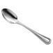A Libbey stainless steel dessert spoon with a silver handle.