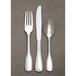 A Libbey Wellington stainless steel cocktail fork.