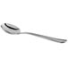 A Libbey stainless steel bouillon spoon with a silver handle.