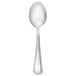 A Libbey stainless steel teaspoon with a white handle.