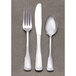 A Libbey stainless steel iced tea spoon on a gray surface.