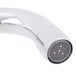 A close-up of a chrome Equip by T&S deck-mounted faucet with lever handles.