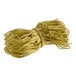 A close-up of a bundle of gold rope with a gold ribbon.