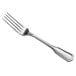 A Libbey stainless steel dinner fork with a silver handle.