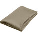A folded beige cloth on a white background.