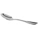 A Libbey stainless steel dessert spoon with a silver handle.