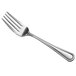 A close-up of a Libbey stainless steel salad fork with a silver handle.