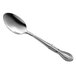 A Libbey stainless steel dessert spoon with a handle.