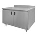 A stainless steel enclosed base work table with a fixed midshelf and backsplash.