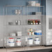 A metal wire shelving unit with food items on it.