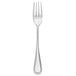 A silver Libbey McIntosh dinner fork with a white background.