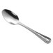 A Libbey stainless steel dessert spoon with a silver handle and spoon.