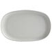 A light gray oval melamine plate with an irregular shape.