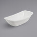 A white bowl on a gray surface.