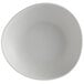 A light gray irregular round melamine serving bowl.