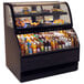A black Structural Concepts refrigerated dual service merchandiser with drinks and food displayed inside.