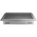 A Regency stainless steel floor trough grate on a metal grate.