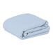 A folded light blue rectangular Intedge table cover.