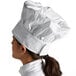 a woman wearing a chef's hat