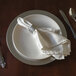 a white napkin on a plate