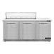 A stainless steel Continental Refrigerator sandwich prep table with three doors open.