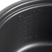 A close up of a black non-stick pot for an Avantco rice cooker.
