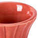 A close up of a red ceramic CAC Festiware ramekin.