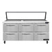 A stainless steel Continental Refrigerator with hinged glass lids over six refrigerated drawers.