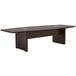 A brown Safco Aberdeen rectangular conference table with a black base and two legs.