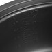 An Avantco non-stick pot for a rice cooker on a counter in a professional kitchen.