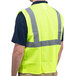 A man wearing a Cordova lime high visibility safety vest.