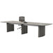 A Safco Medina steel gray rectangular conference table with chairs and a computer mouse on it.
