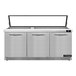 A Continental Refrigerator stainless steel refrigerated sandwich prep table with three doors.