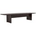 A brown Safco Aberdeen rectangular conference table with a black base.