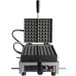A Hatco Krampouz Liege Style Belgian waffle maker with a black handle.
