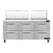 A stainless steel Continental Refrigerator with 6 drawers.