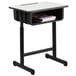 A black Flash Furniture student desk with a white surface and a shelf.